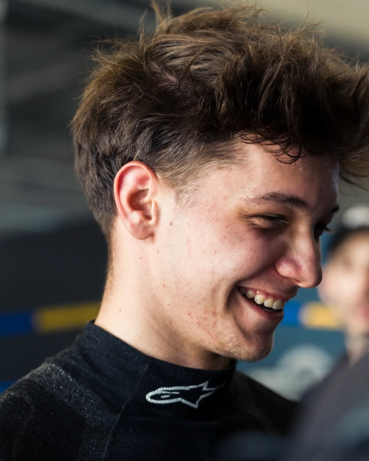 Siro Zambra laughing in the garage at the Nürburgring